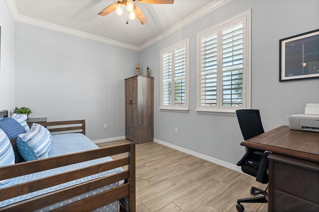 100 Silver Maple Road Groveland, FL 34736 - Photo 19 of 54 a view of a workspace with furniture and a window