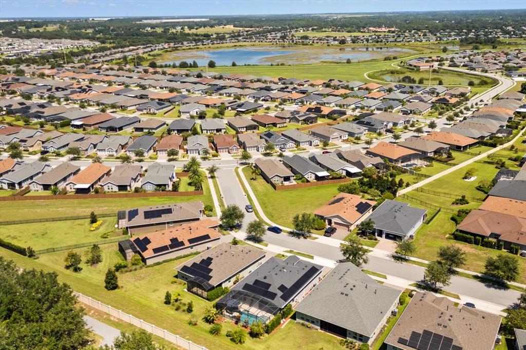 100 Silver Maple Road Groveland, FL 34736 - Photo 26 of 54 an aerial view of residential houses with outdoor space