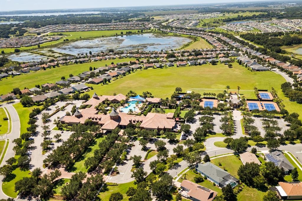 100 Silver Maple Road Groveland, FL 34736 - Photo 27 of 54 an aerial view of residential building and lake