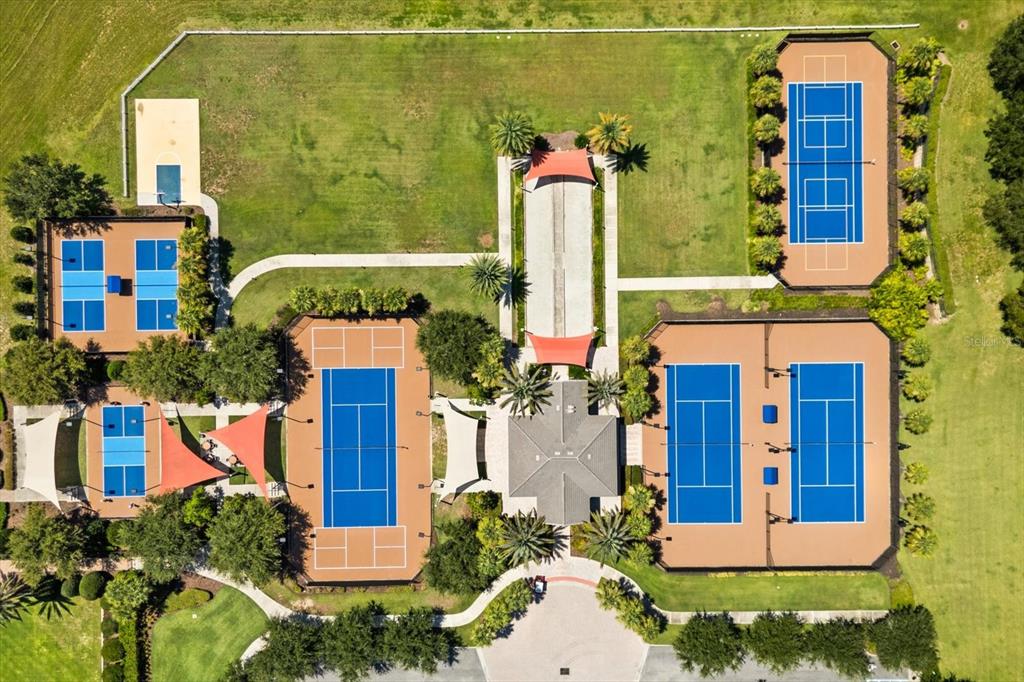 100 Silver Maple Road Groveland, FL 34736 - Photo 33 of 54 a front view of a house with a yard