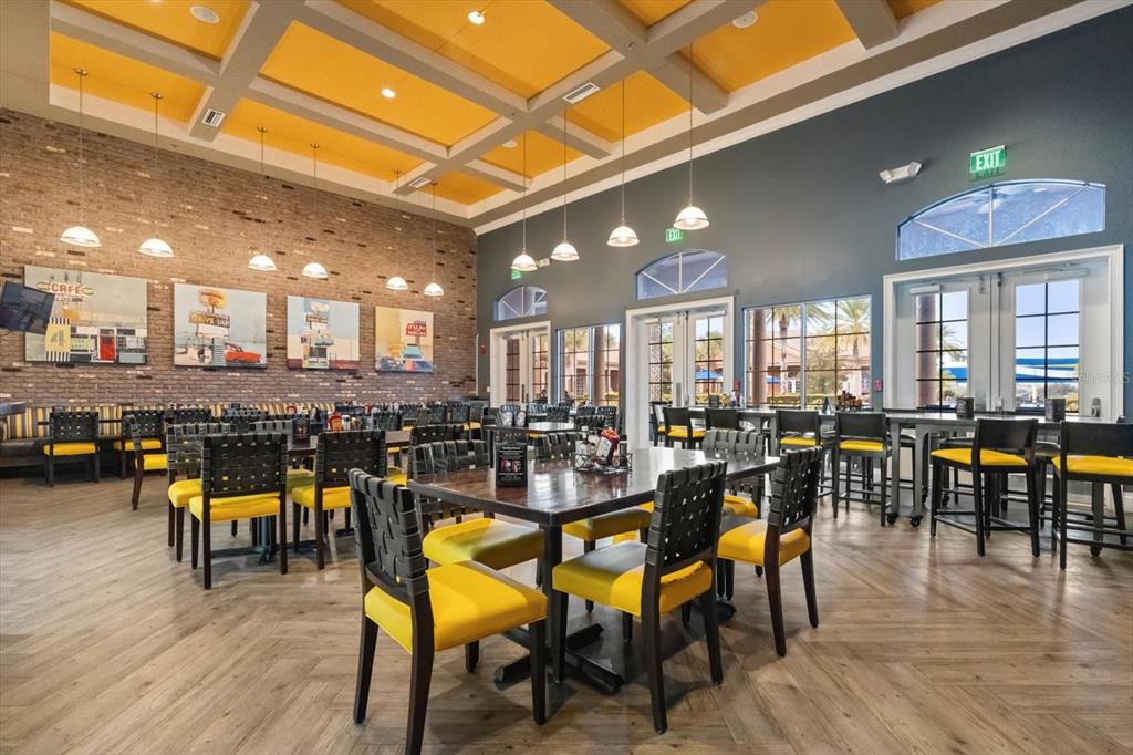 100 Silver Maple Road Groveland, FL 34736 - Photo 42 of 54 a view of a dining hall with lots of furniture and wooden floor