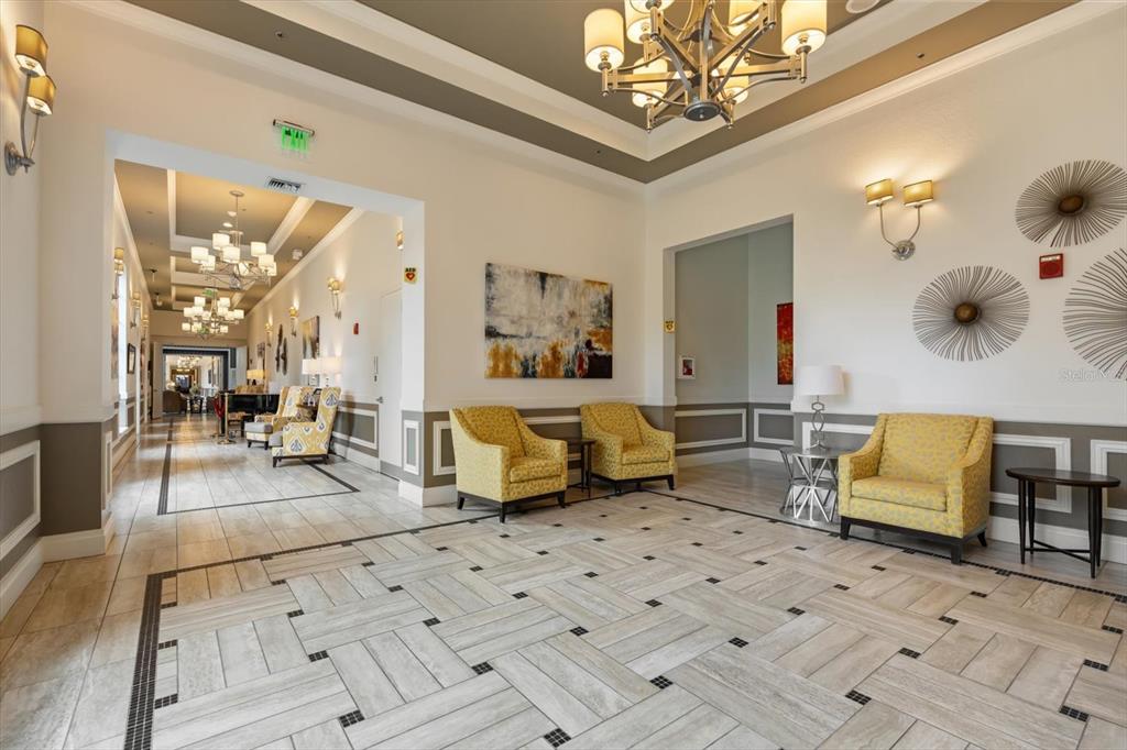 100 Silver Maple Road Groveland, FL 34736 - Photo 46 of 54 a living room with furniture and a chandelier