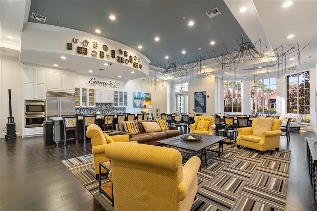 100 Silver Maple Road Groveland, FL 34736 - Photo 47 of 54 a very nice looking living room with kitchen and a chandelier