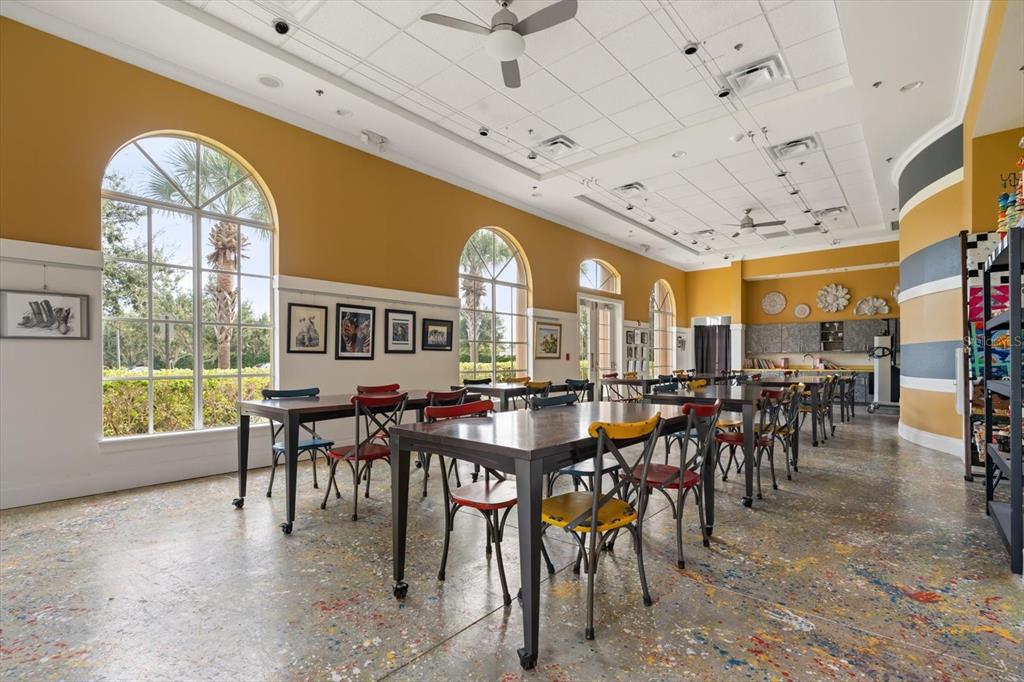 100 Silver Maple Road Groveland, FL 34736 - Photo 48 of 54 a view of a dining hall with many windows