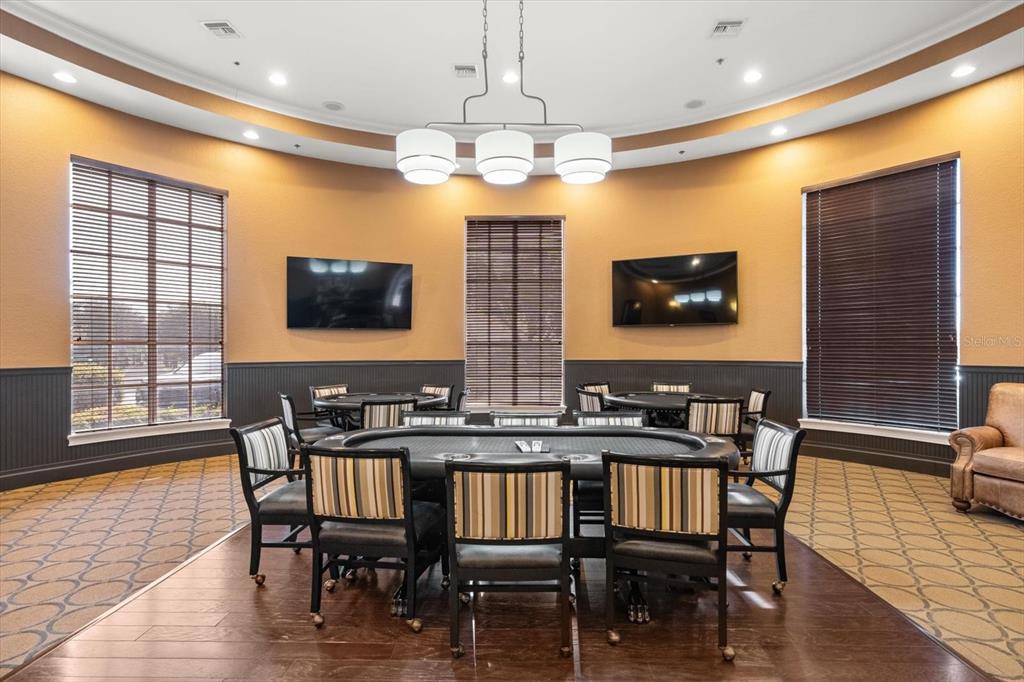 100 Silver Maple Road Groveland, FL 34736 - Photo 49 of 54 a view of a dining room with furniture window and wooden floor