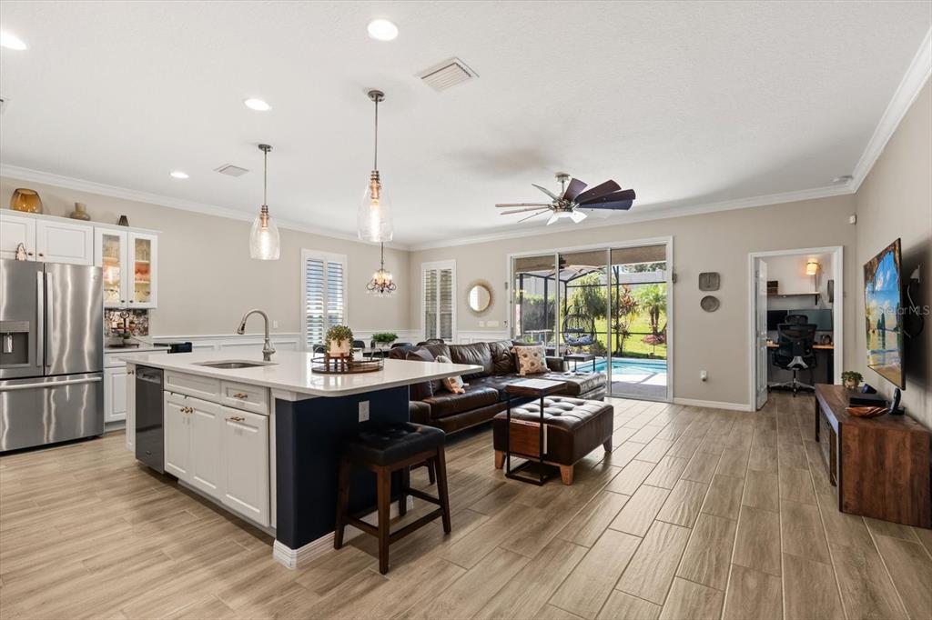 100 Silver Maple Road Groveland, FL 34736 - Photo 10 of 54 a open kitchen with stainless steel appliances granite countertop a stove and cabinets