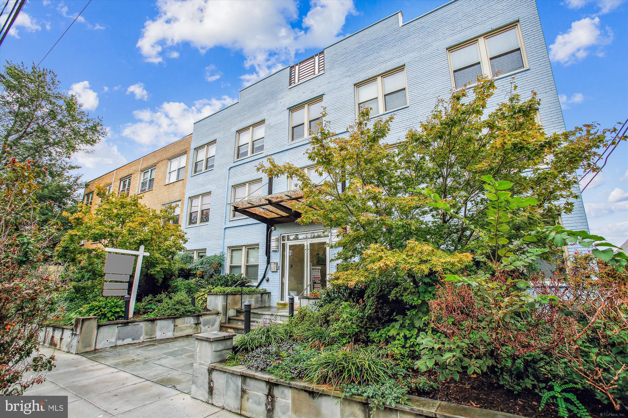 922 Madison Street Northwest, Unit 201 Washington, DC 20011 - Photo 2 of 34 a front view of a building with garden