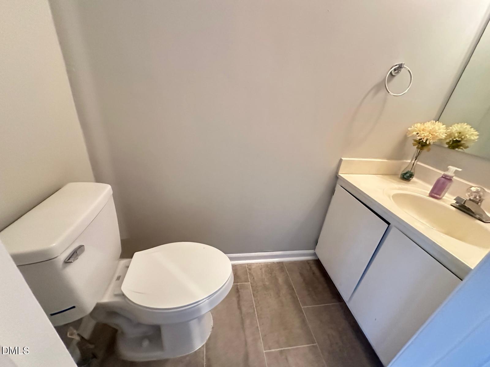 322 Junction Road, Unit 28H Durham, NC 27703 - Photo 13 of 18 a white toilet sitting next to a white sink