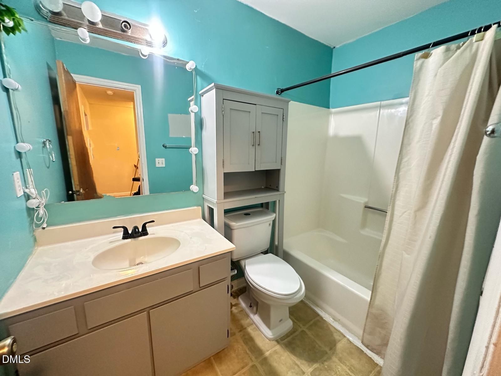 322 Junction Road, Unit 28H Durham, NC 27703 - Photo 18 of 18 a bathroom with a sink a toilet and shower