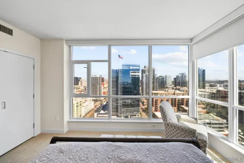 a living room with a large window and a table