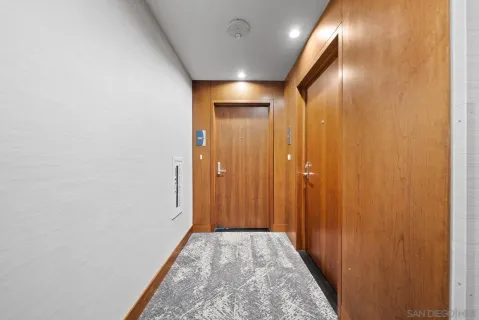 a view of hallway with livingroom