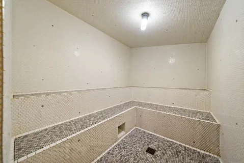 a bathroom with a bath tub and shower