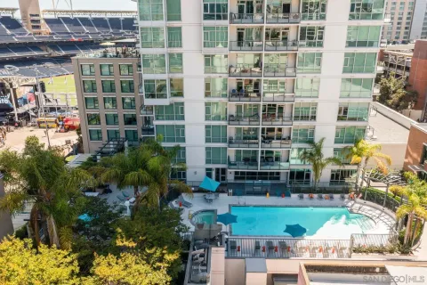 a front view of a building with a garden