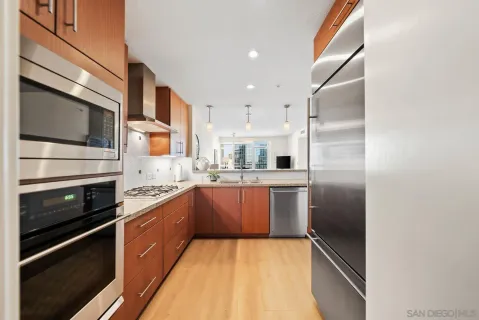 a kitchen with cabinets and stainless steel appliances