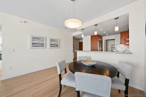 a view of a dining room with furniture and wooden floor