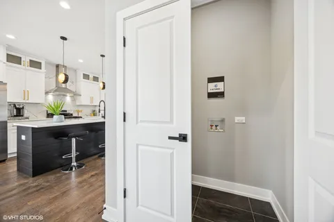 a view of hallway with wooden floor