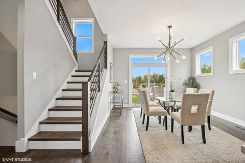 a view of a dining room with furniture window and wooden floor