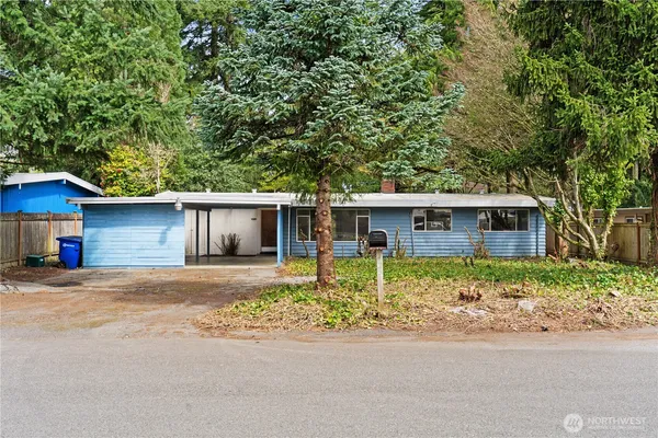 a house with trees in the background