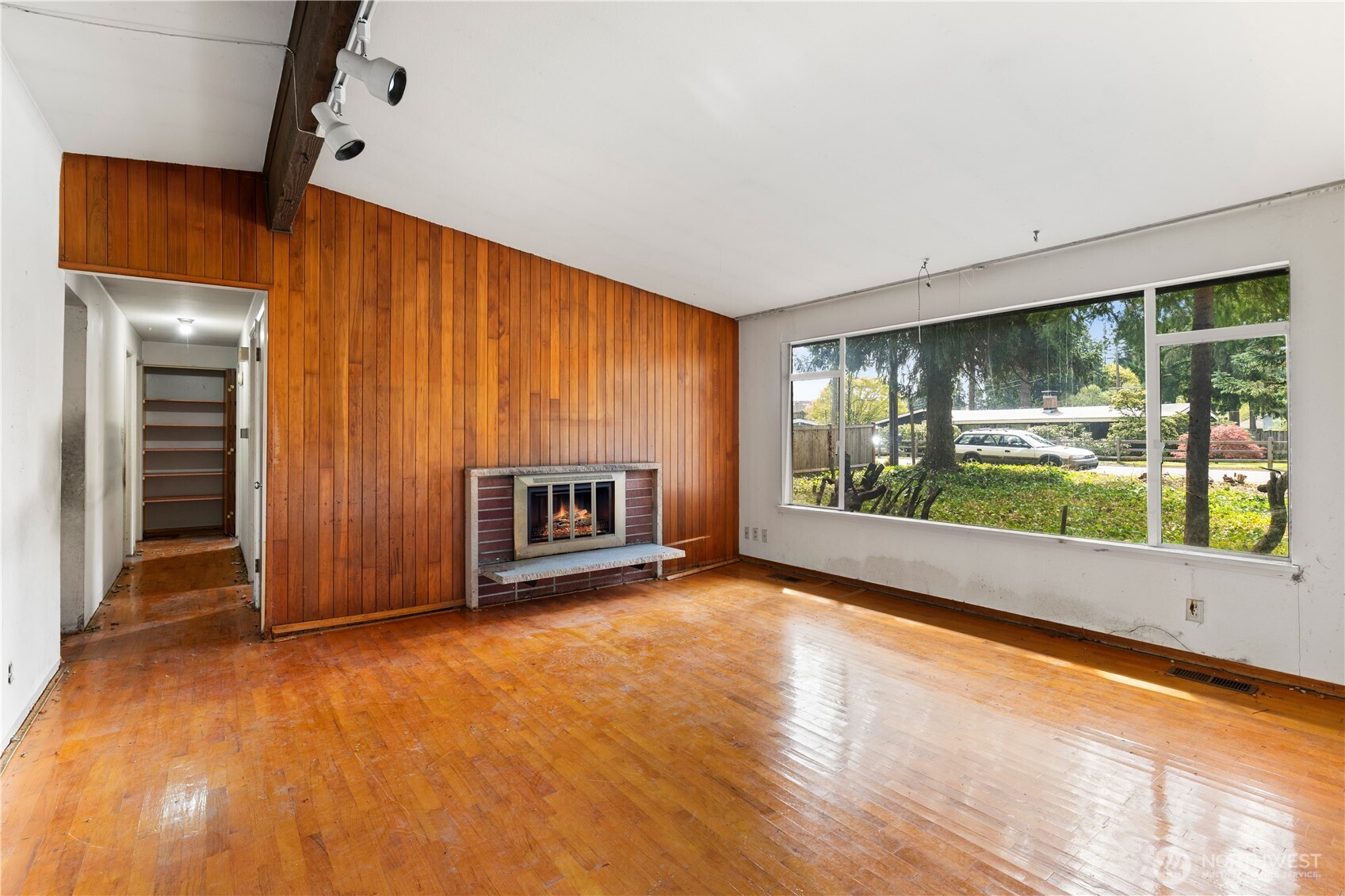9012 Northeast 178th Street Bothell, WA 98011 - Photo 11 of 30 an empty room with floor to ceiling windows and an entryway