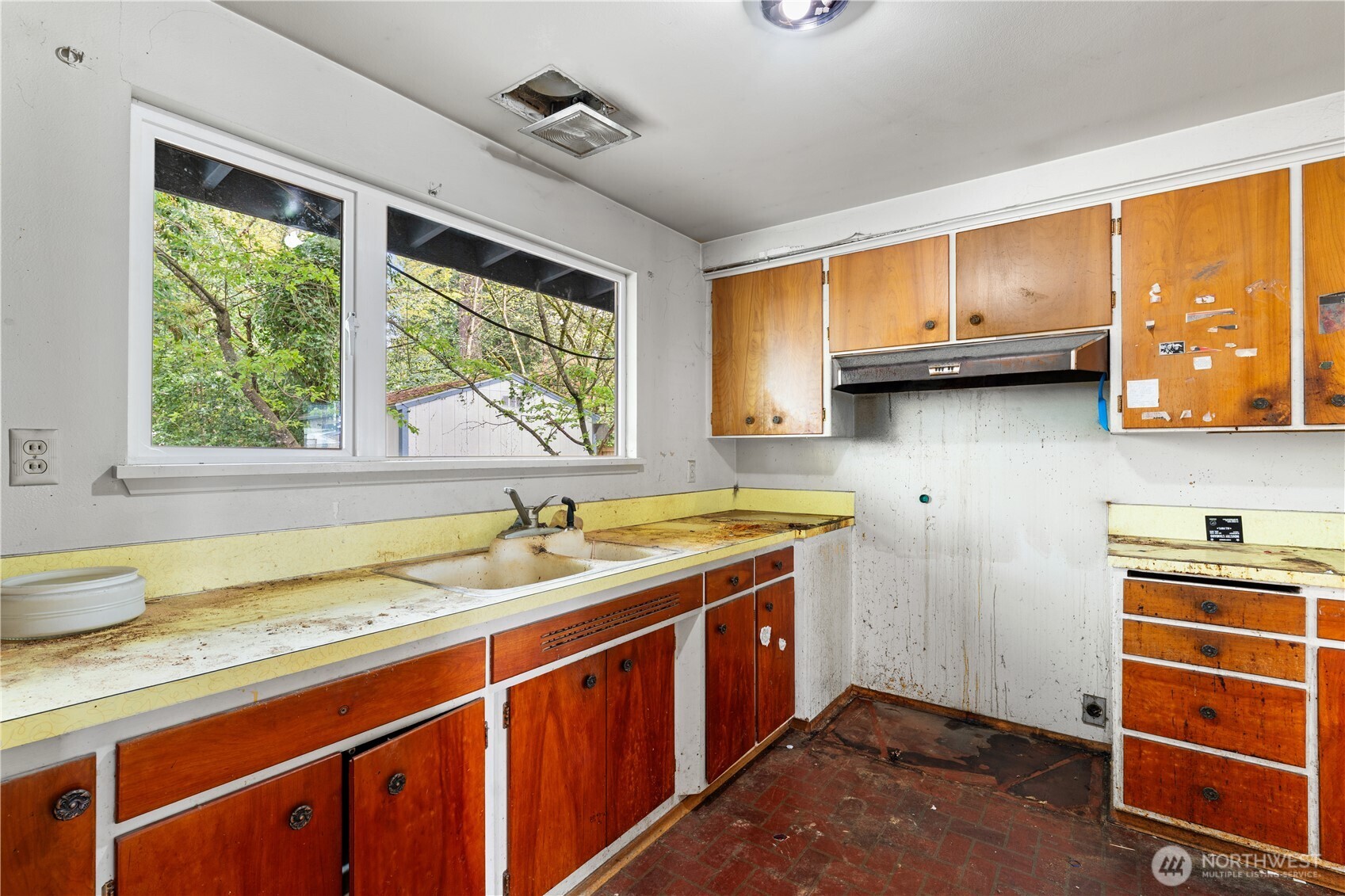 9012 Northeast 178th Street Bothell, WA 98011 - Photo 19 of 30 a kitchen with a sink and a window