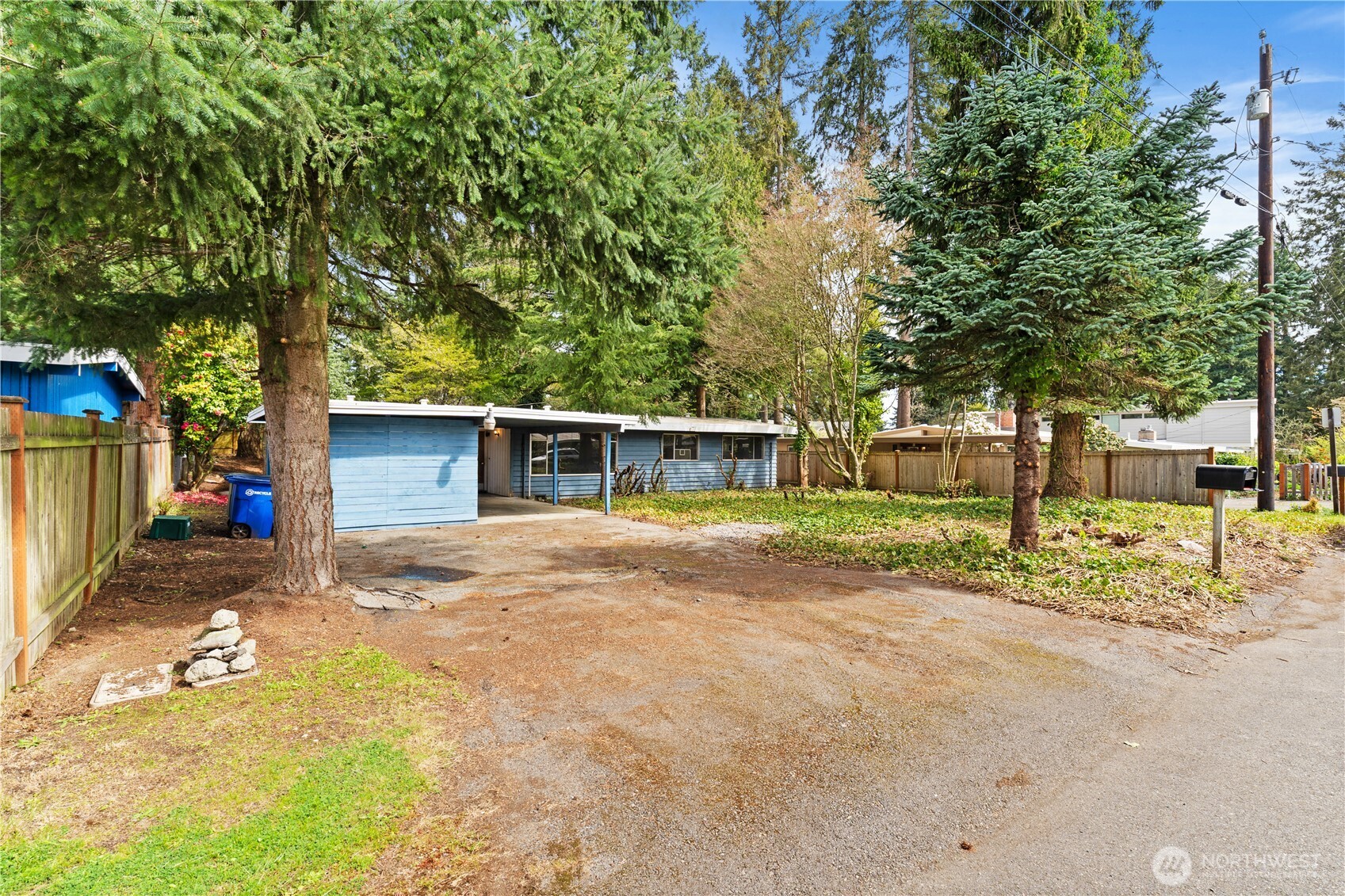 9012 Northeast 178th Street Bothell, WA 98011 - Photo 2 of 30 a front view of a house with a yard and trees