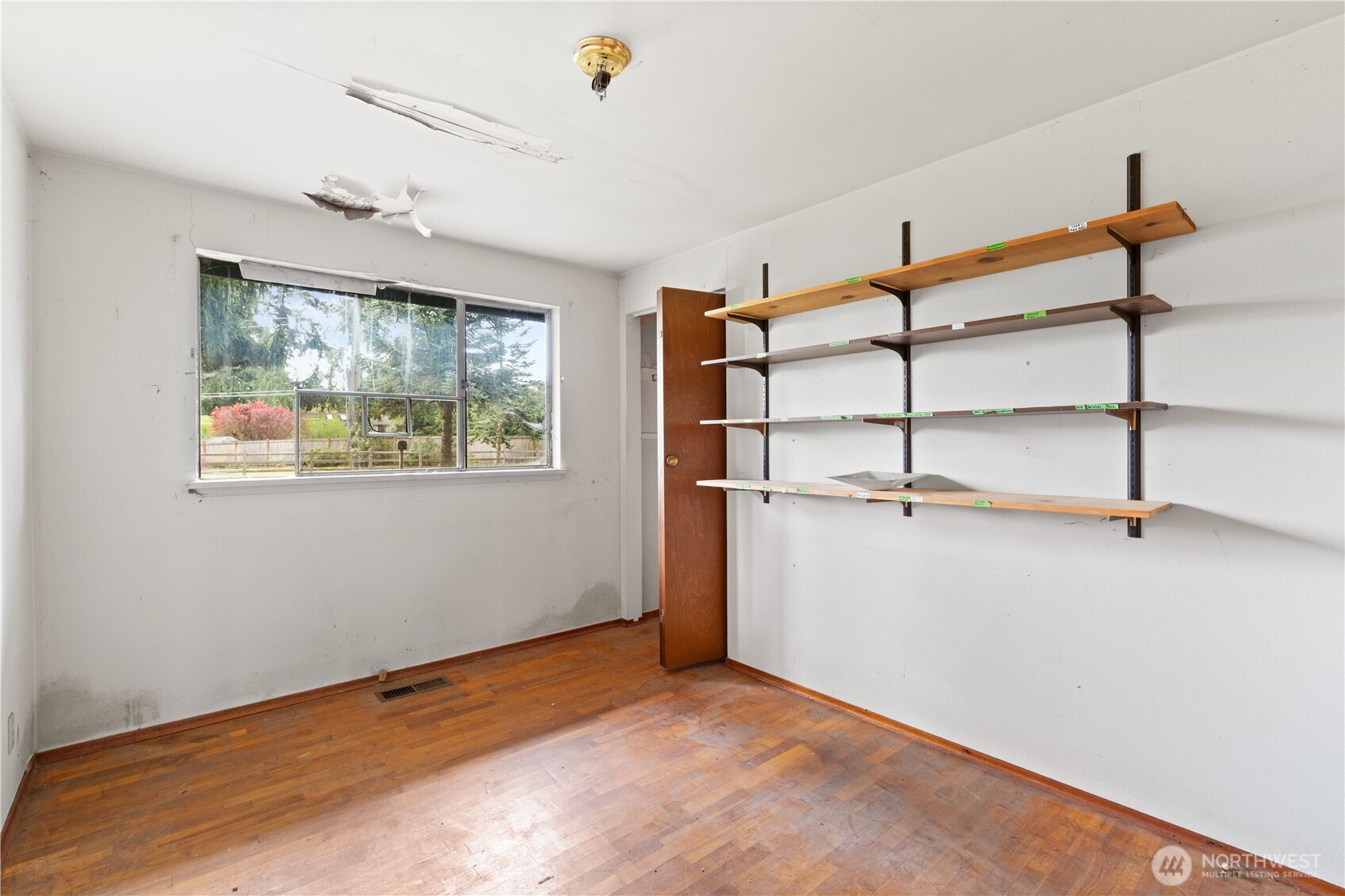 9012 Northeast 178th Street Bothell, WA 98011 - Photo 23 of 30 a view of a room with shelf on the wall