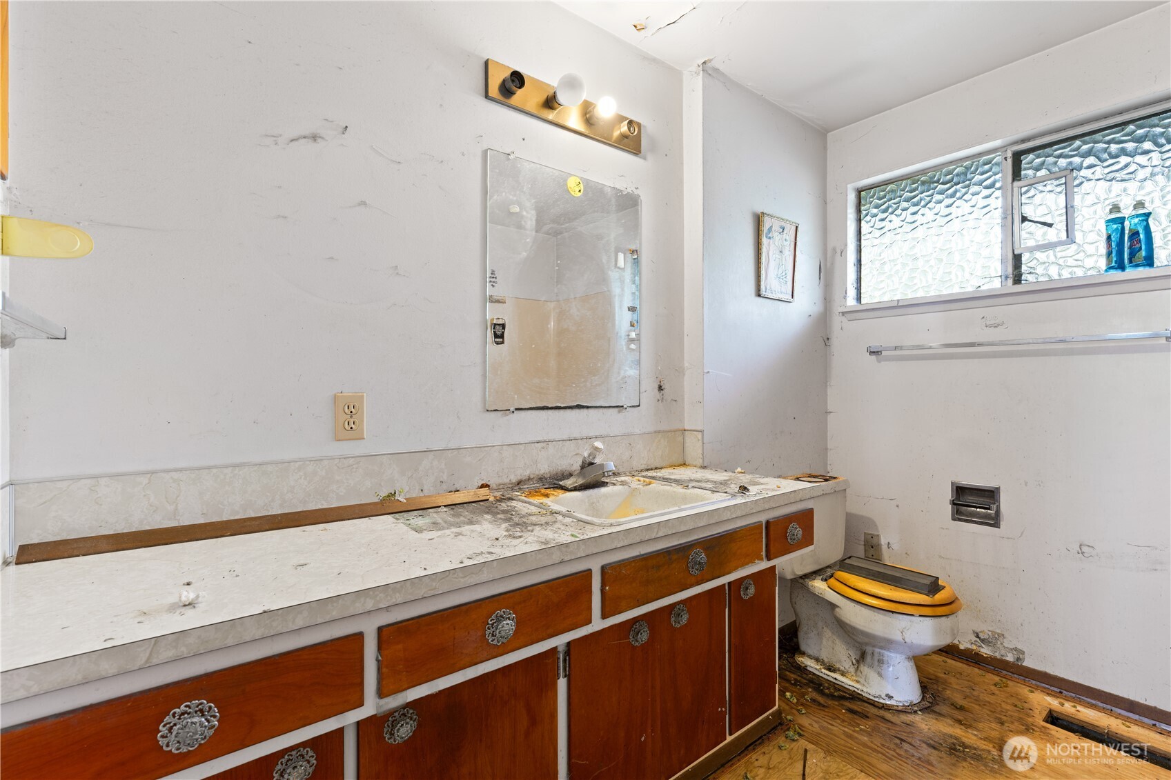 9012 Northeast 178th Street Bothell, WA 98011 - Photo 24 of 30 a bathroom with a granite countertop toilet a sink and a mirror