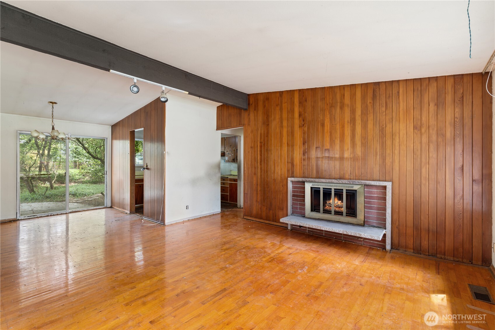 9012 Northeast 178th Street Bothell, WA 98011 - Photo 9 of 30 a view of a livingroom with wooden floor and a fireplace