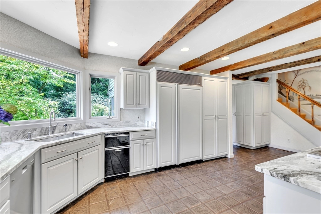 147 Shaker Road Longmeadow, MA 01106 - Photo 13 of 42 a kitchen with granite countertop white cabinets and white appliances