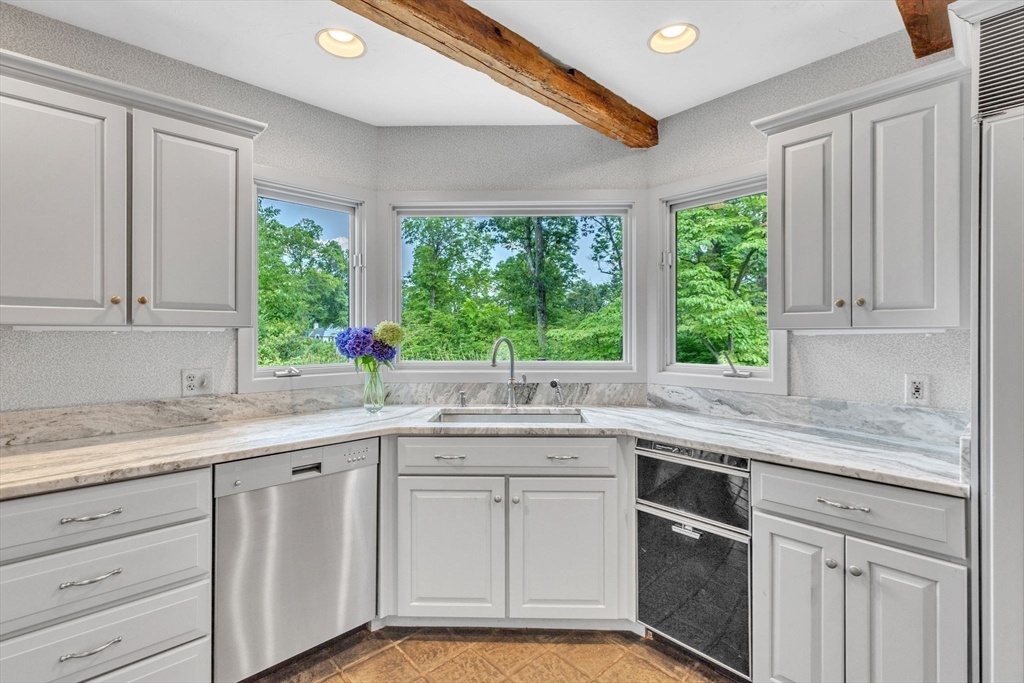 147 Shaker Road Longmeadow, MA 01106 - Photo 14 of 42 a kitchen with a sink stove and cabinets