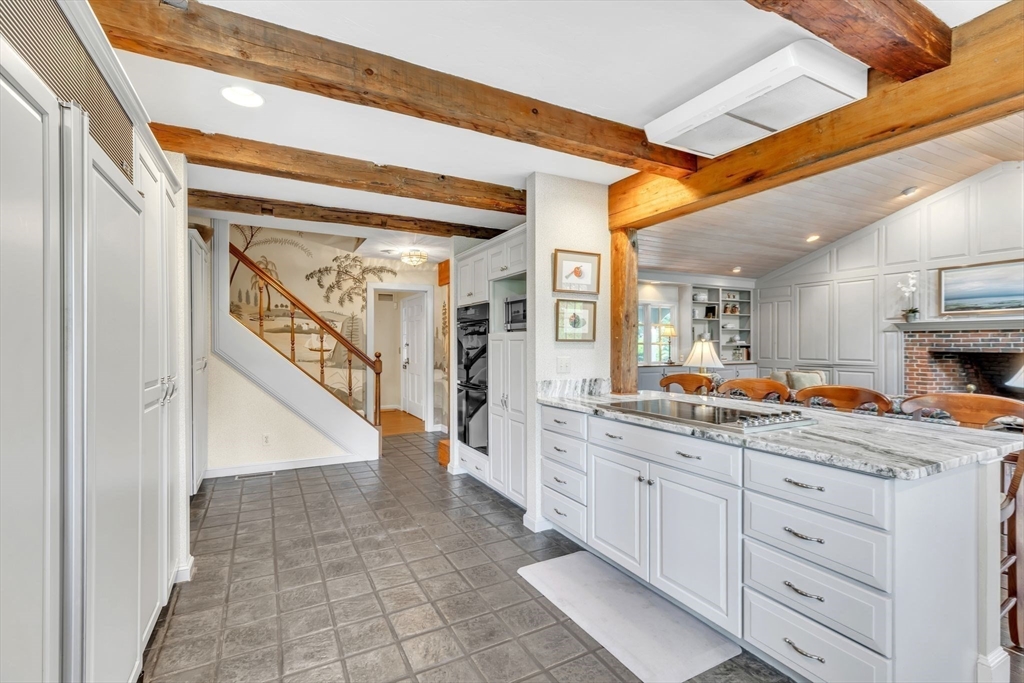147 Shaker Road Longmeadow, MA 01106 - Photo 15 of 42 a kitchen with stainless steel appliances kitchen island granite countertop cabinets and a sink