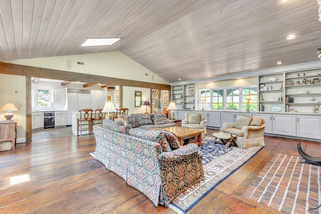147 Shaker Road Longmeadow, MA 01106 - Photo 17 of 42 a living room with furniture wooden floor and a rug