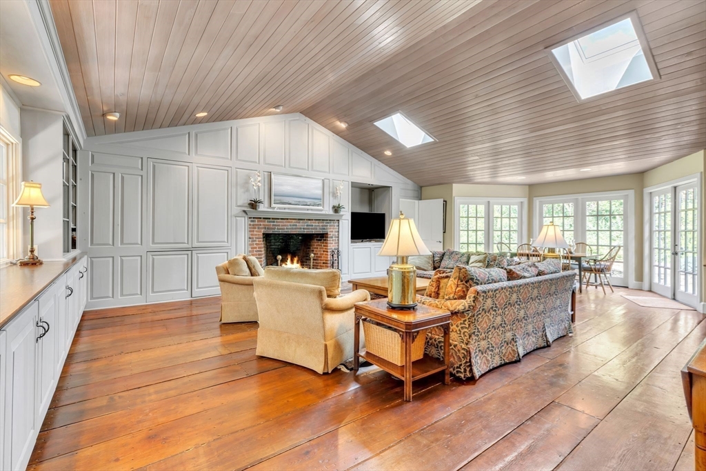 147 Shaker Road Longmeadow, MA 01106 - Photo 18 of 42 a living room with fireplace furniture and a large window