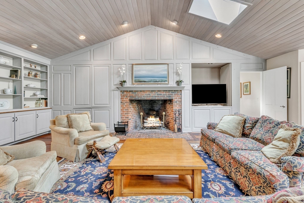 147 Shaker Road Longmeadow, MA 01106 - Photo 19 of 42 a living room with furniture and a fireplace
