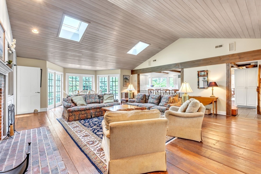 147 Shaker Road Longmeadow, MA 01106 - Photo 20 of 42 a living room with fireplace furniture and a large window