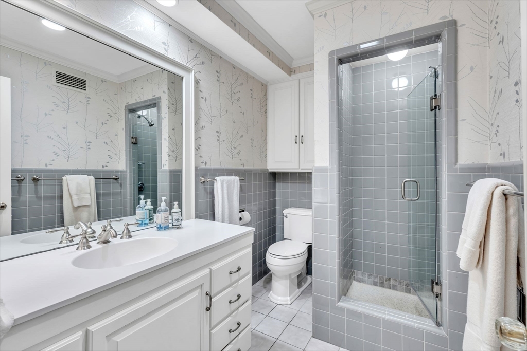 147 Shaker Road Longmeadow, MA 01106 - Photo 23 of 42 a bathroom with a sink a toilet and shower