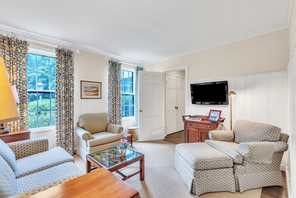 147 Shaker Road Longmeadow, MA 01106 - Photo 24 of 42 a living room with furniture and a flat screen tv