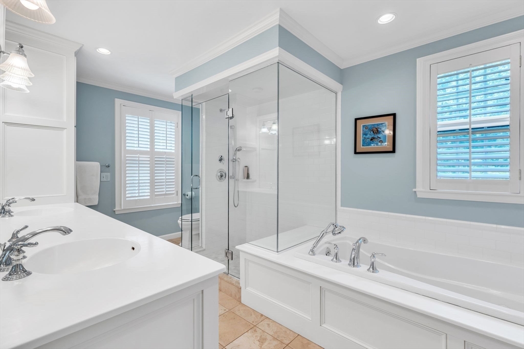 147 Shaker Road Longmeadow, MA 01106 - Photo 29 of 42 a spacious bathroom with a tub sink and mirror