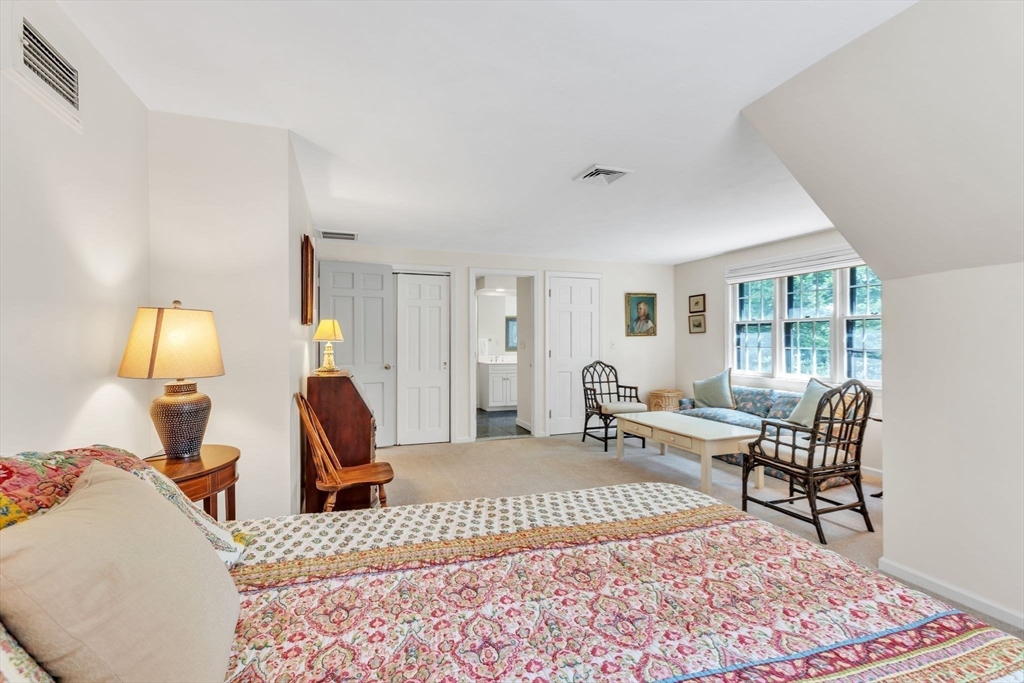 147 Shaker Road Longmeadow, MA 01106 - Photo 32 of 42 a bed room with a bed and wooden floor