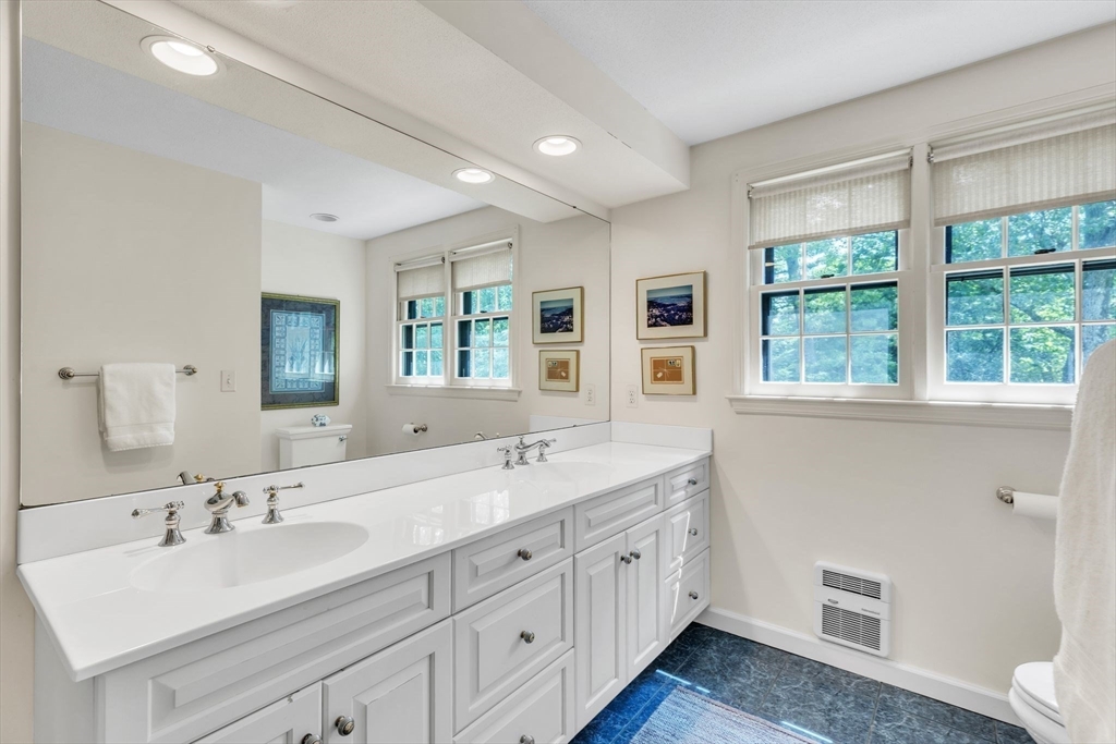 147 Shaker Road Longmeadow, MA 01106 - Photo 33 of 42 a bathroom with double vanity sink a mirror a window and vanity