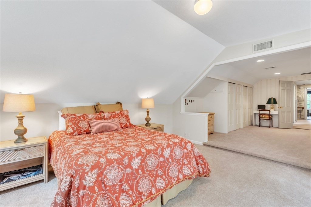 147 Shaker Road Longmeadow, MA 01106 - Photo 36 of 42 a spacious bedroom with a bed and a lamp