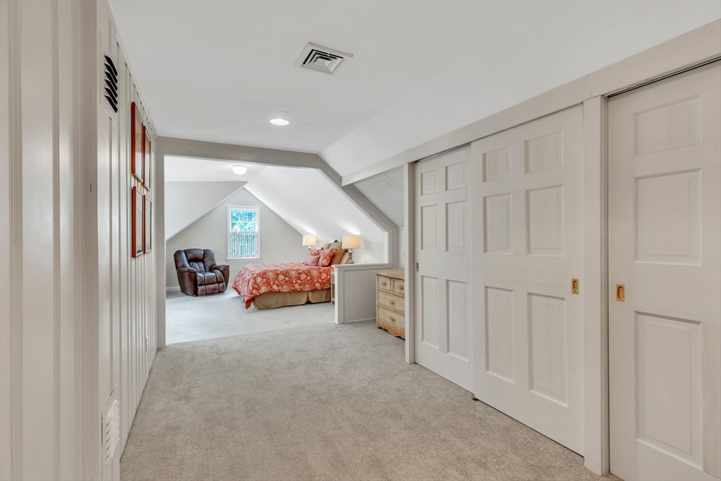 147 Shaker Road Longmeadow, MA 01106 - Photo 37 of 42 a big room with closet and a chandelier fan