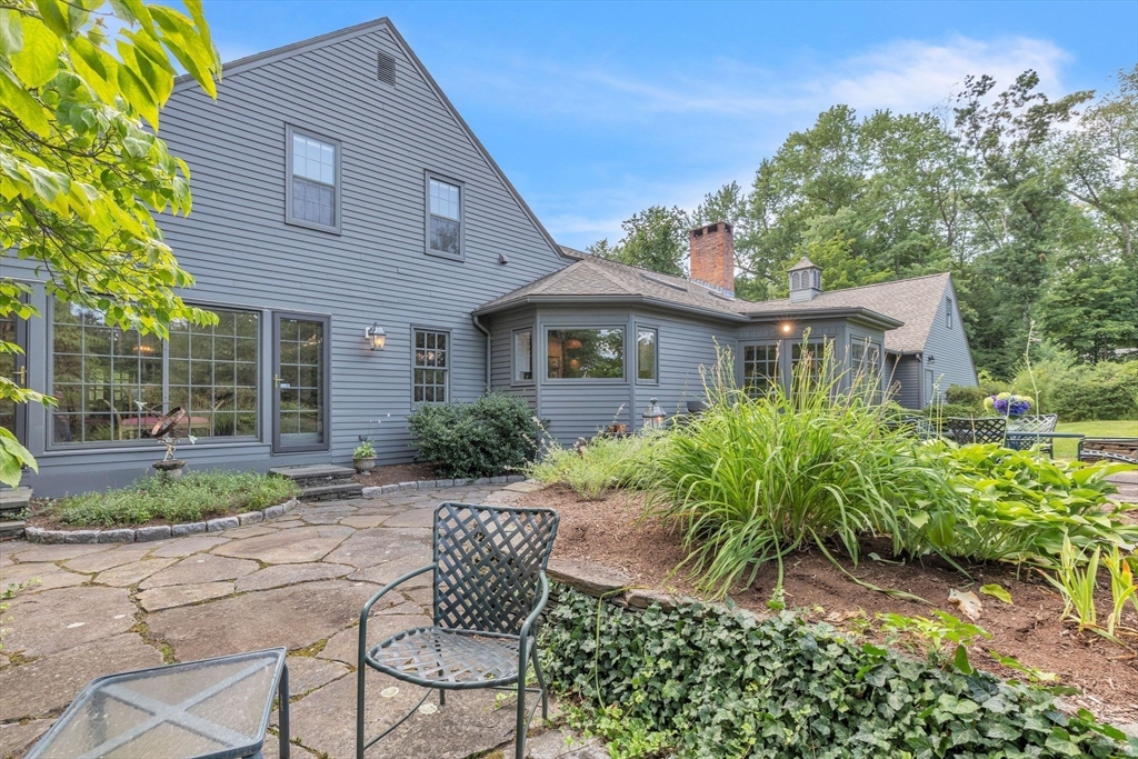 147 Shaker Road Longmeadow, MA 01106 - Photo 40 of 42 a view of a house with a yard and sitting area