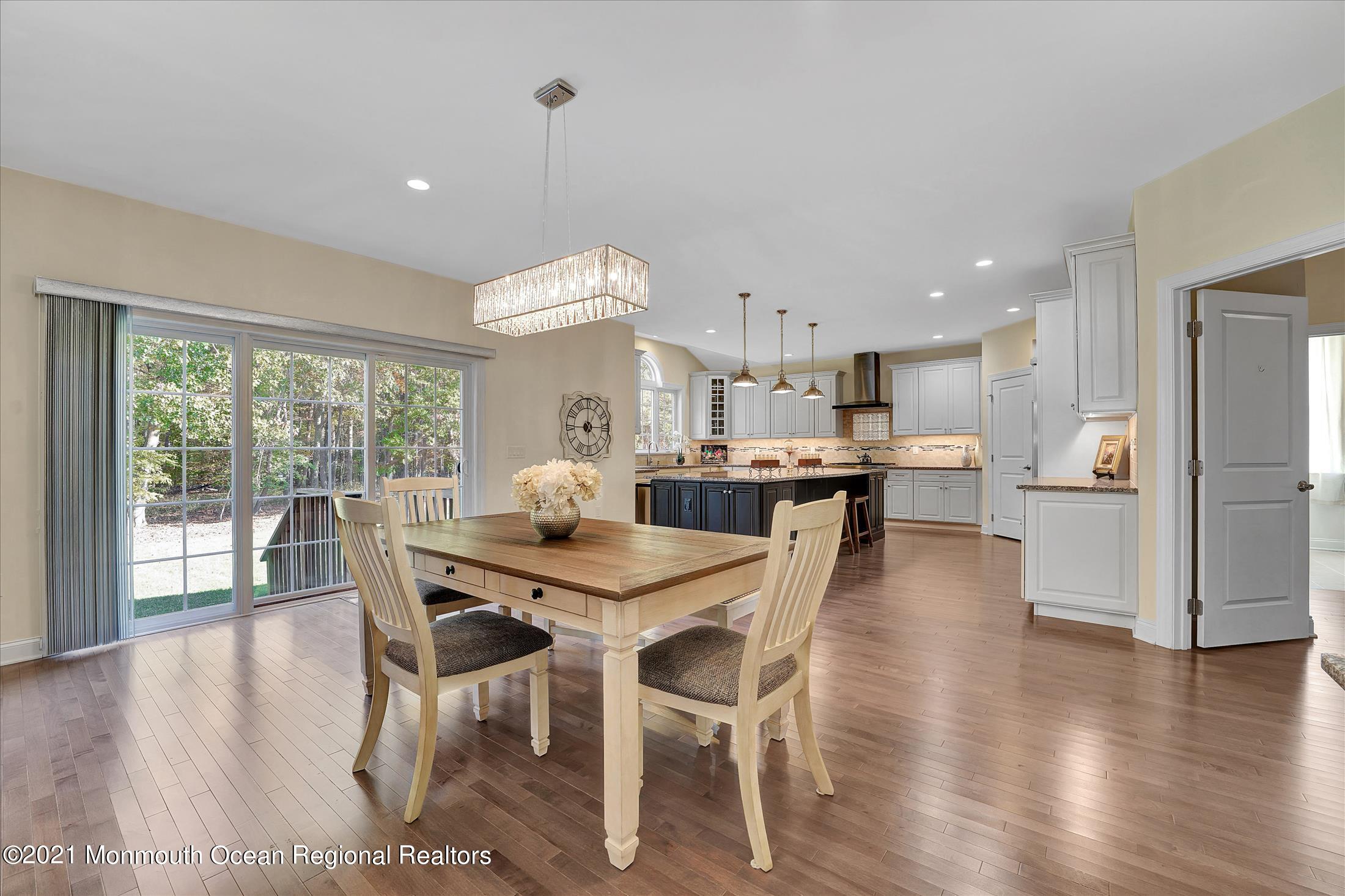 30 Weathervane Circle Cream Ridge, NJ 08514 - Photo 14 of 39 a view of a dining room with furniture and wooden floor