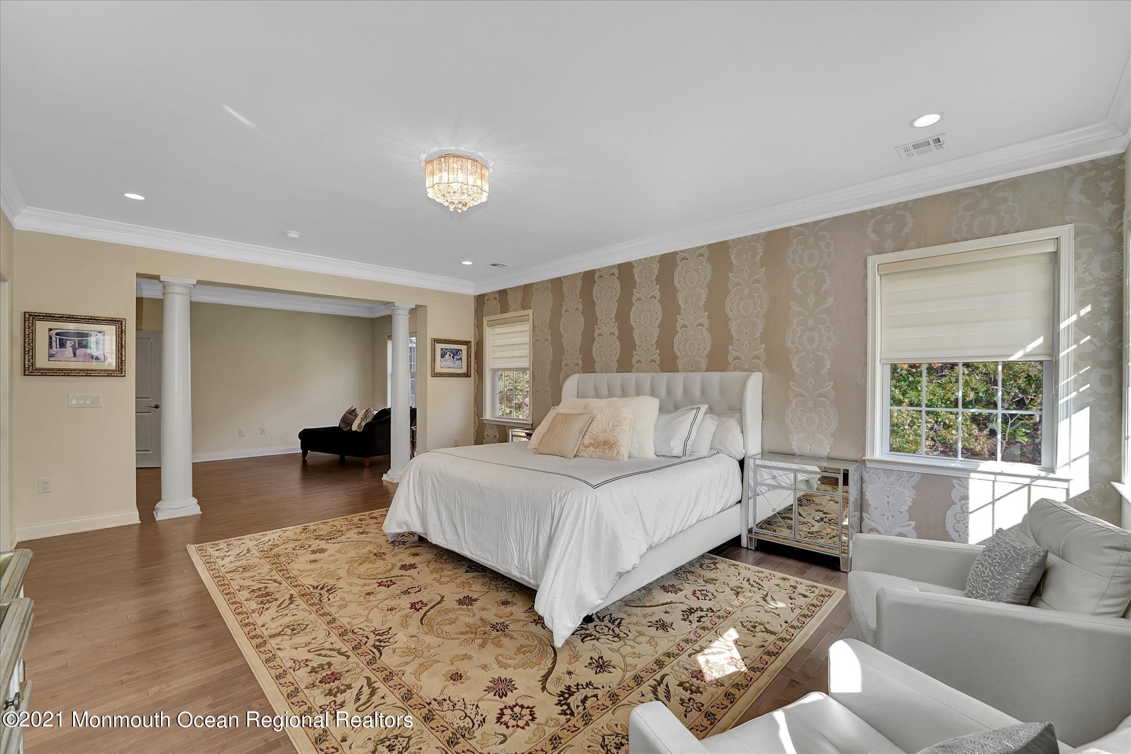 30 Weathervane Circle Cream Ridge, NJ 08514 - Photo 22 of 39 a spacious bedroom with a bed a couch and a window