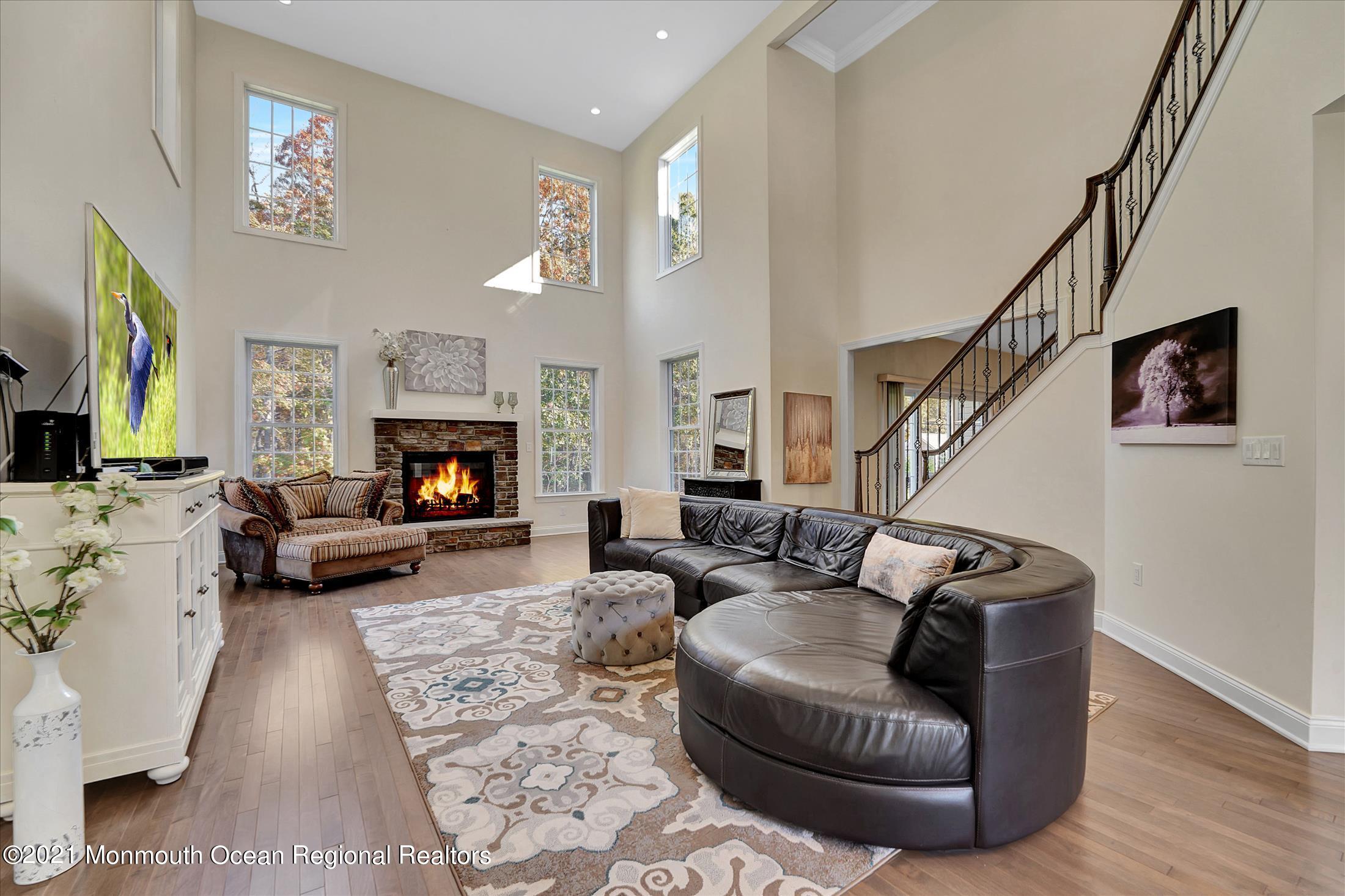 30 Weathervane Circle Cream Ridge, NJ 08514 - Photo 8 of 39 a living room with furniture and a fireplace or television