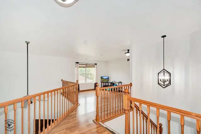 a view of a hallway with windows