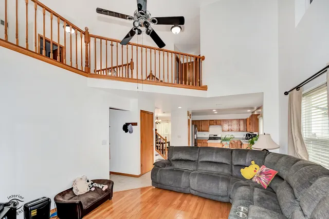a living room with furniture fireplace and a window