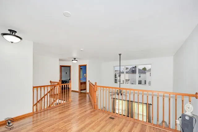 a view of a hallway with seating area