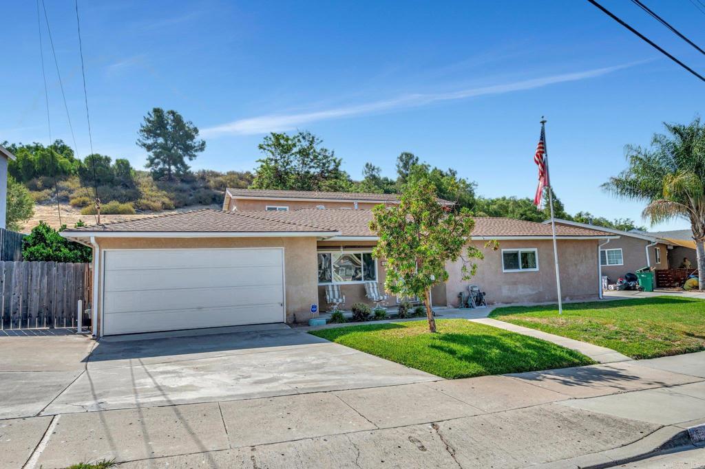 10315 Settle Road Santee, CA 92071 - Photo 1 of 1 a front view of a house with a yard and garage